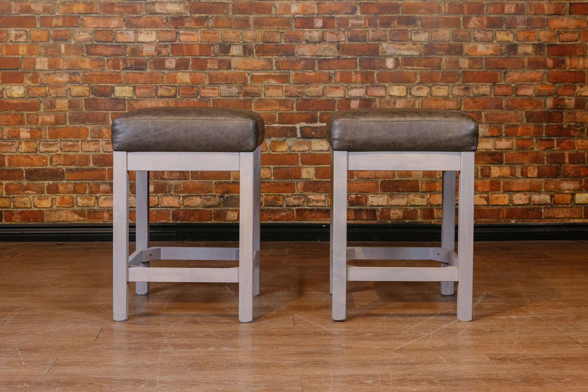 GREY LEATHER WOOD BASE STOOLS