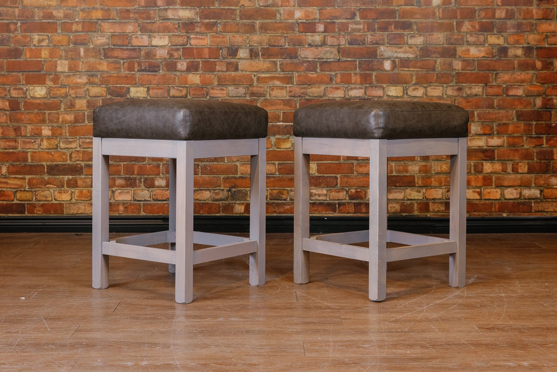 GREY LEATHER WOOD BASE STOOLS