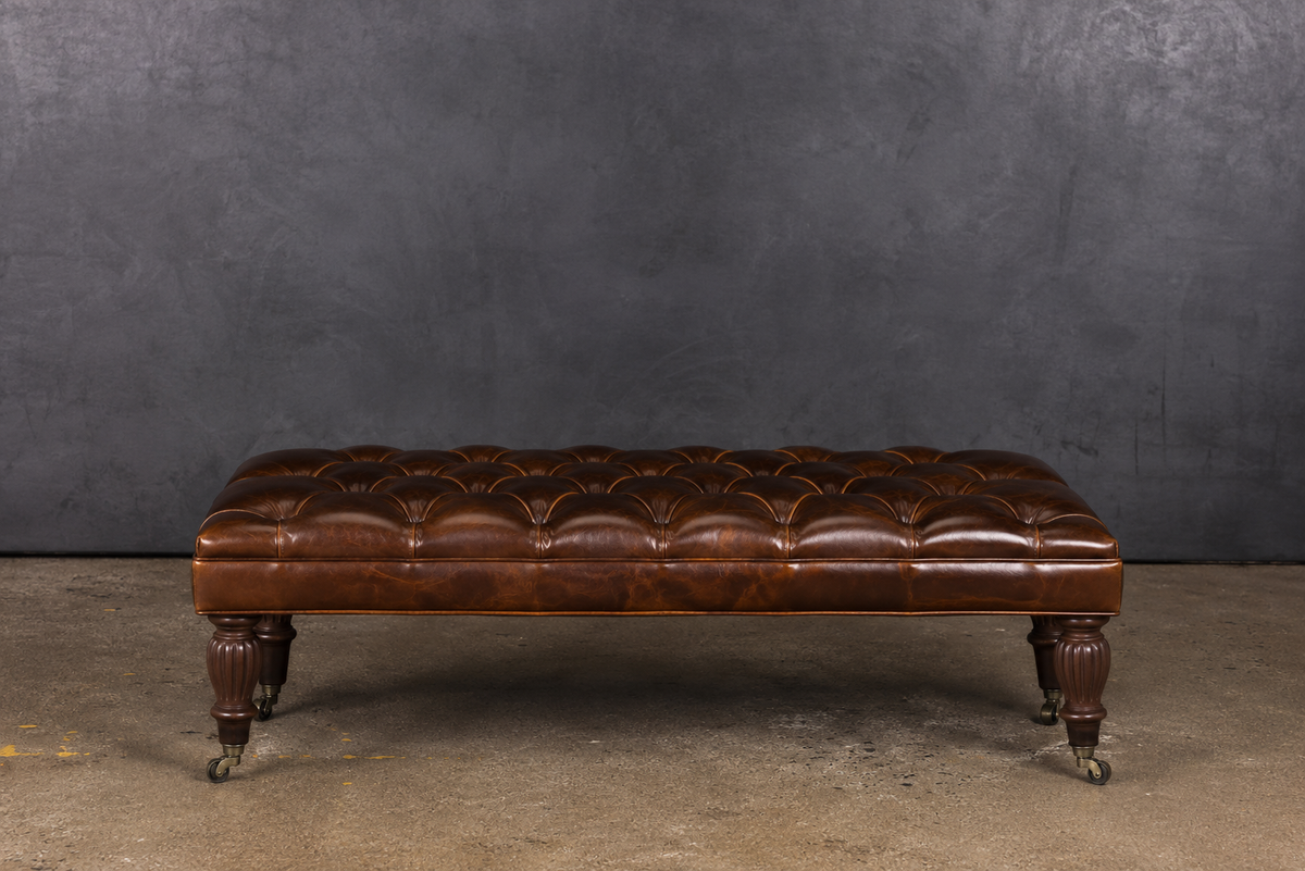 PERCY LEATHER CASTER TUFTED OTTOMAN